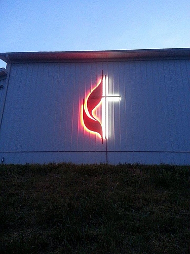 United methodist Cross and Flames night pic of UMC cross