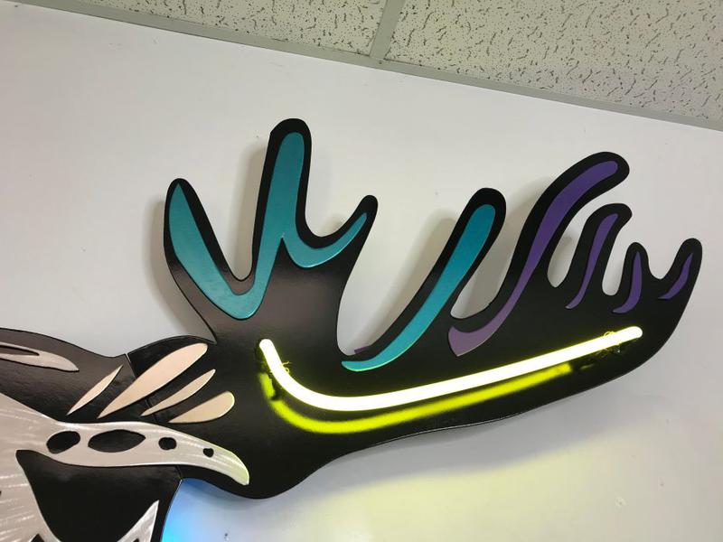 Moose sculpture in aluminum and neon