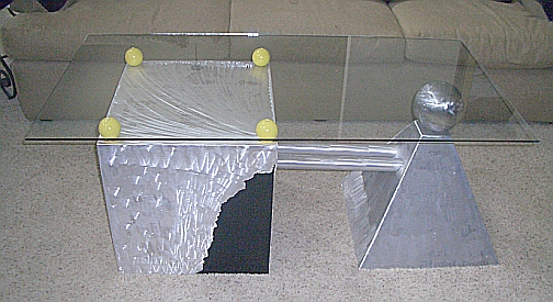 brushed aluminum table with glass top