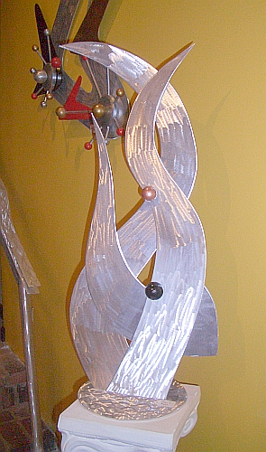 sculpture in brushed aluminum and a tabletop sculpture in modern contemporary sculpture design