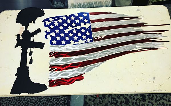 flag sculpture and flag art design with a fallen soldier design