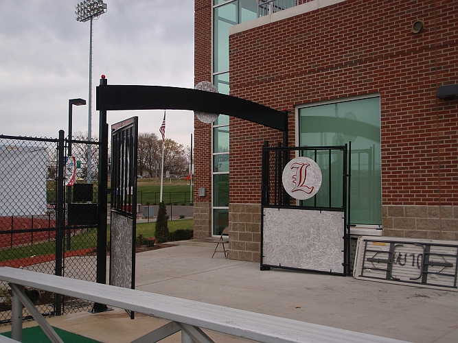 university of louisville field hocky field and U of L logo in aluminum and gates and awning with UofL logo