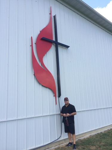 UMC cross and Flames and United Methodisr Cross & Flames sign daytime pic