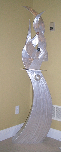 tabletop sculpture in brushed aluminum and a tabletop sculpture in modern contemporary sculpture design
