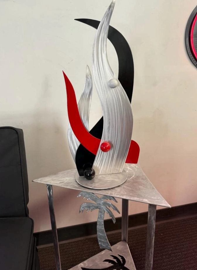 tabletop sculpture in brushed aluminum