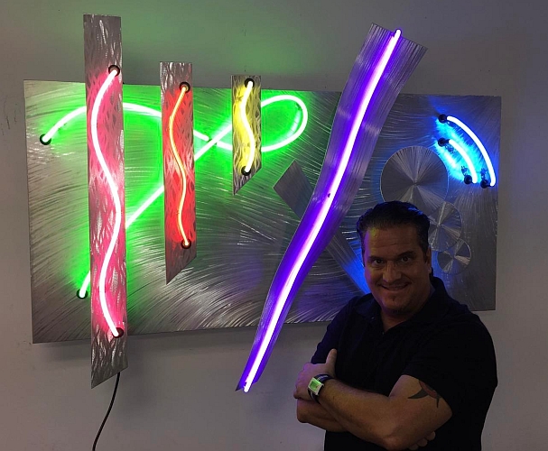 artist Tony Viscardi with his neon sculpture